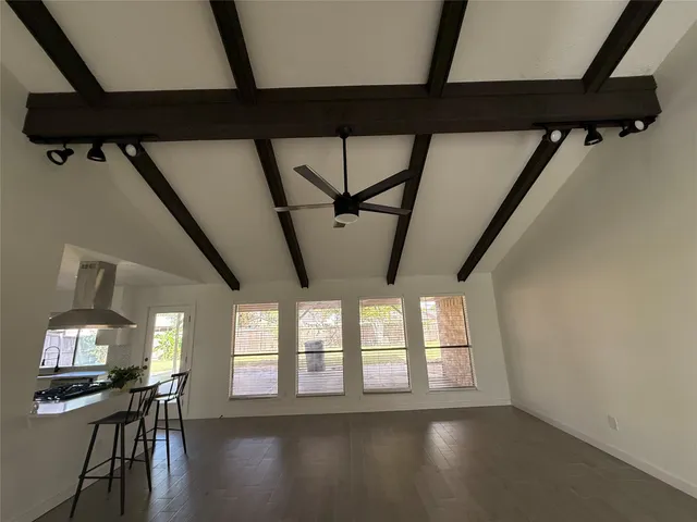 a view of room with furniture and wooden floor