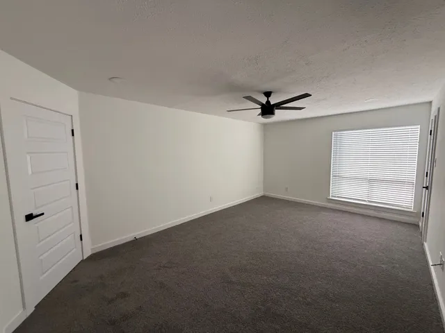 a bathroom with a sink a toilet a mirror and shower
