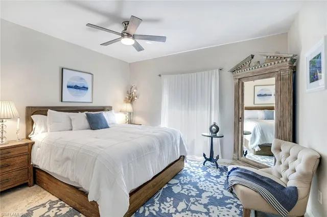 a bedroom with bed and a couch