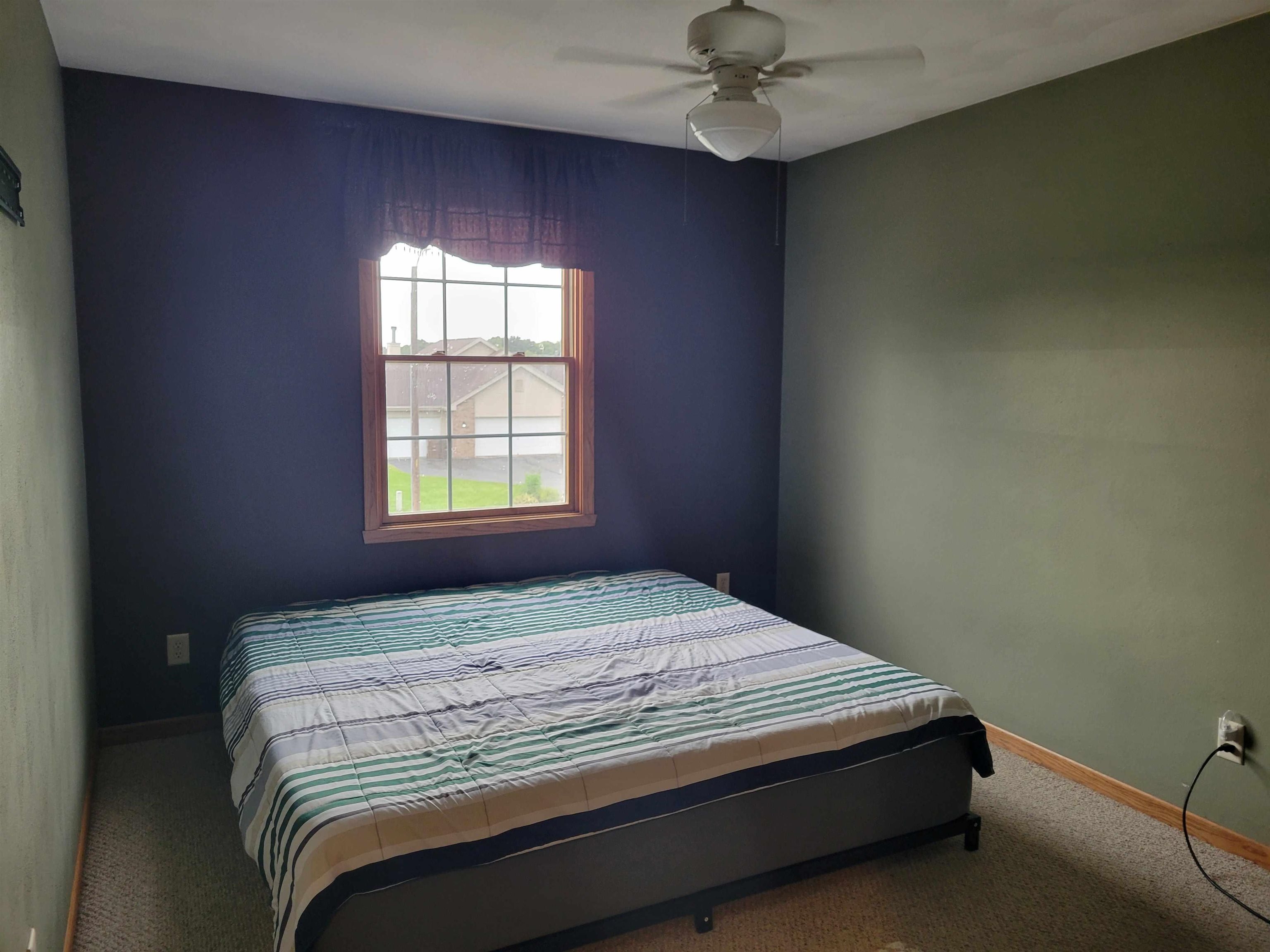 1126 Old Hunter Run Byron, IL 61010 - Photo 19 of 24 a bedroom with a bed and a window