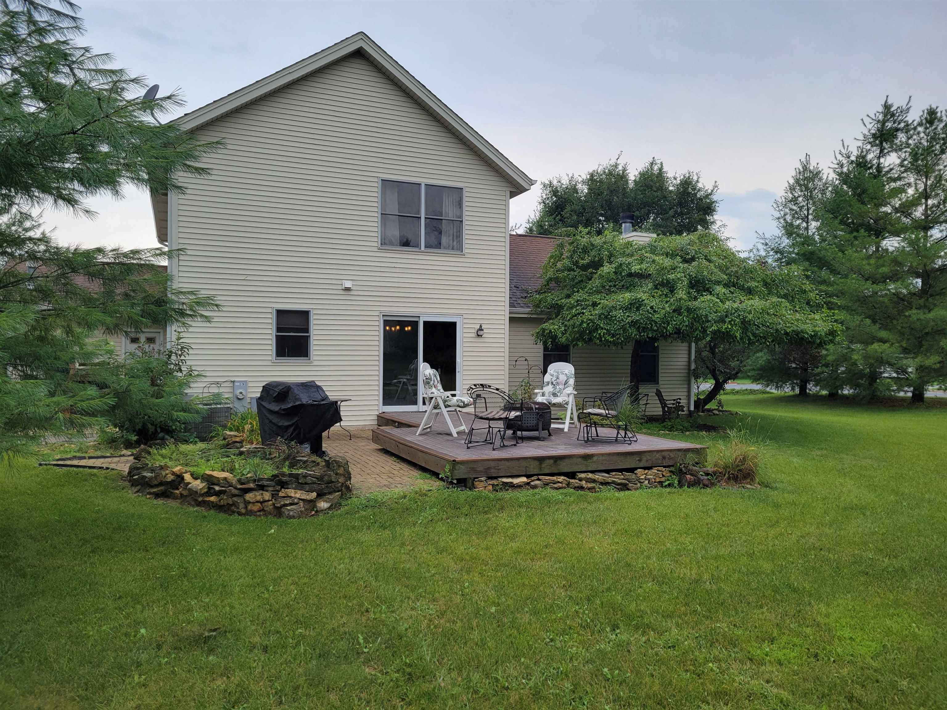 1126 Old Hunter Run Byron, IL 61010 - Photo 21 of 24 a front view of a house with sitting area and garden