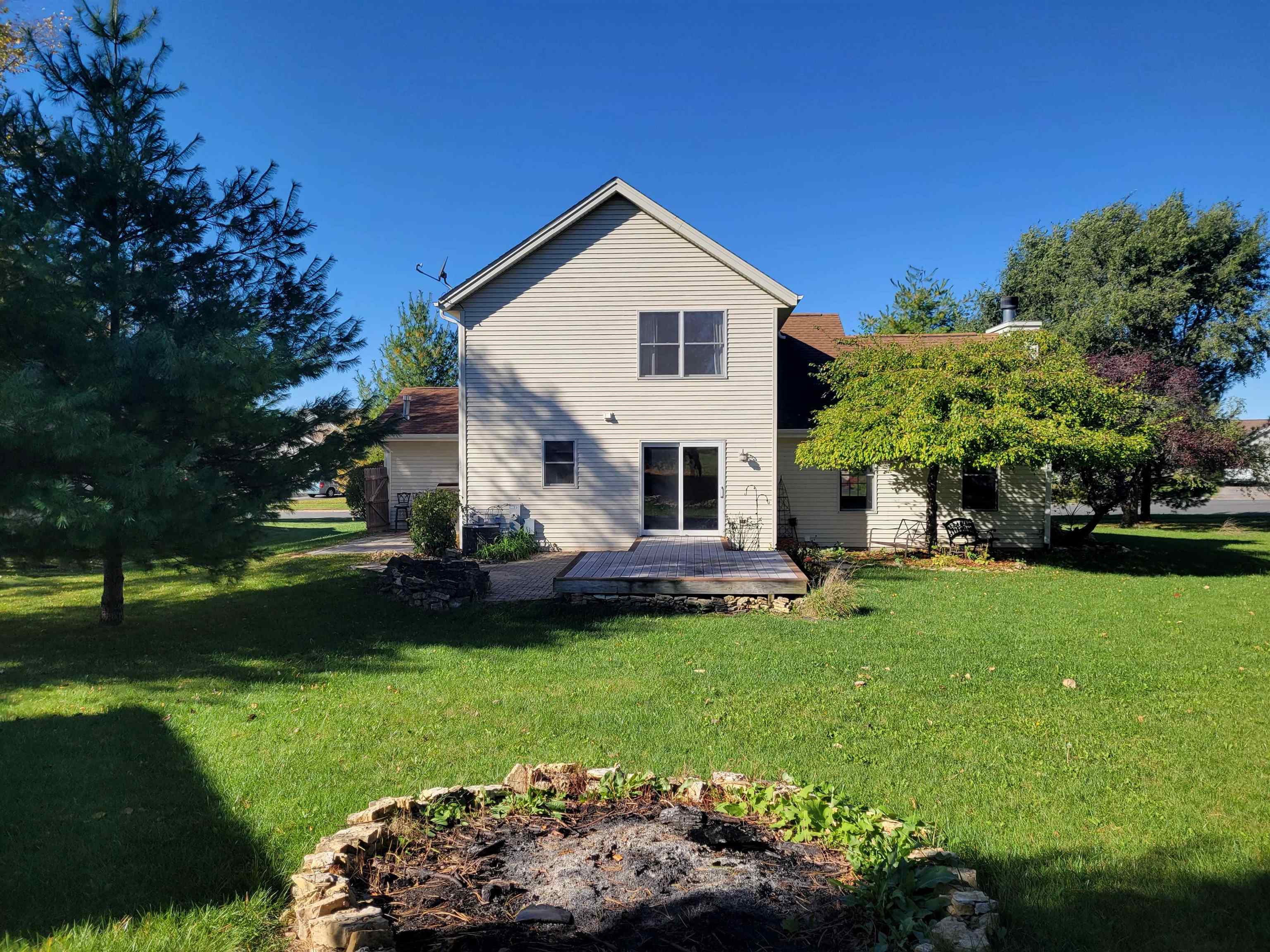 1126 Old Hunter Run Byron, IL 61010 - Photo 23 of 24 a front view of a house with a garden