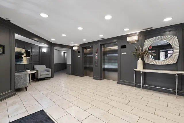 a large room with lots of furniture and a fireplace