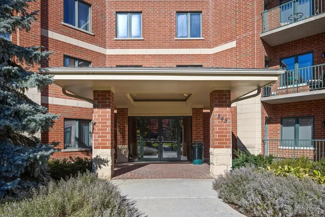 a front view of building with yard