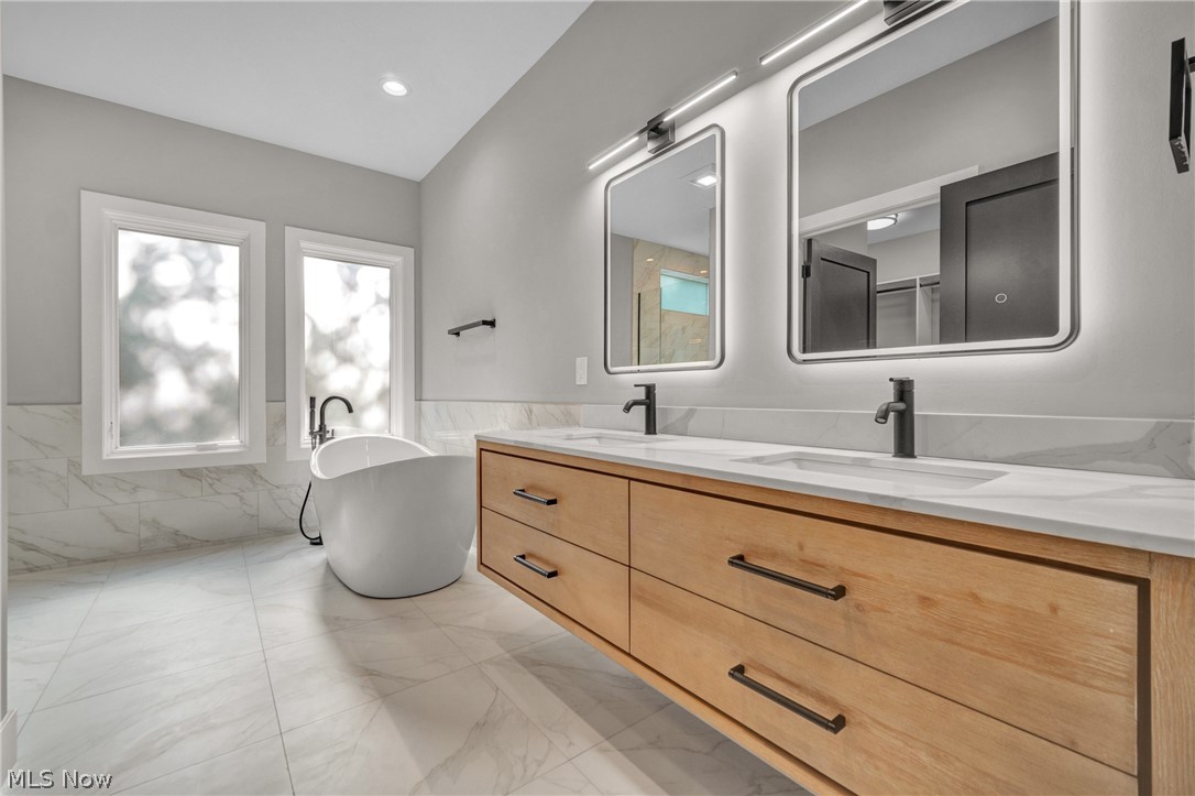 4009 Brainard Road Beachwood, OH 44122 - Photo 25 of 50 Bathroom featuring tile patterned flooring and dual bowl vanity