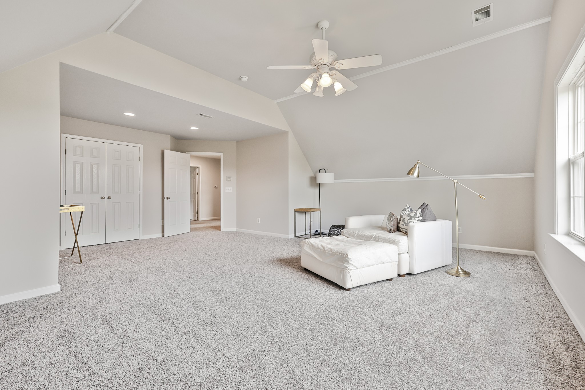 3161 Appian Way Spring Hill, TN 37174 - Photo 26 of 29 a spacious bedroom with a bed and a chandelier