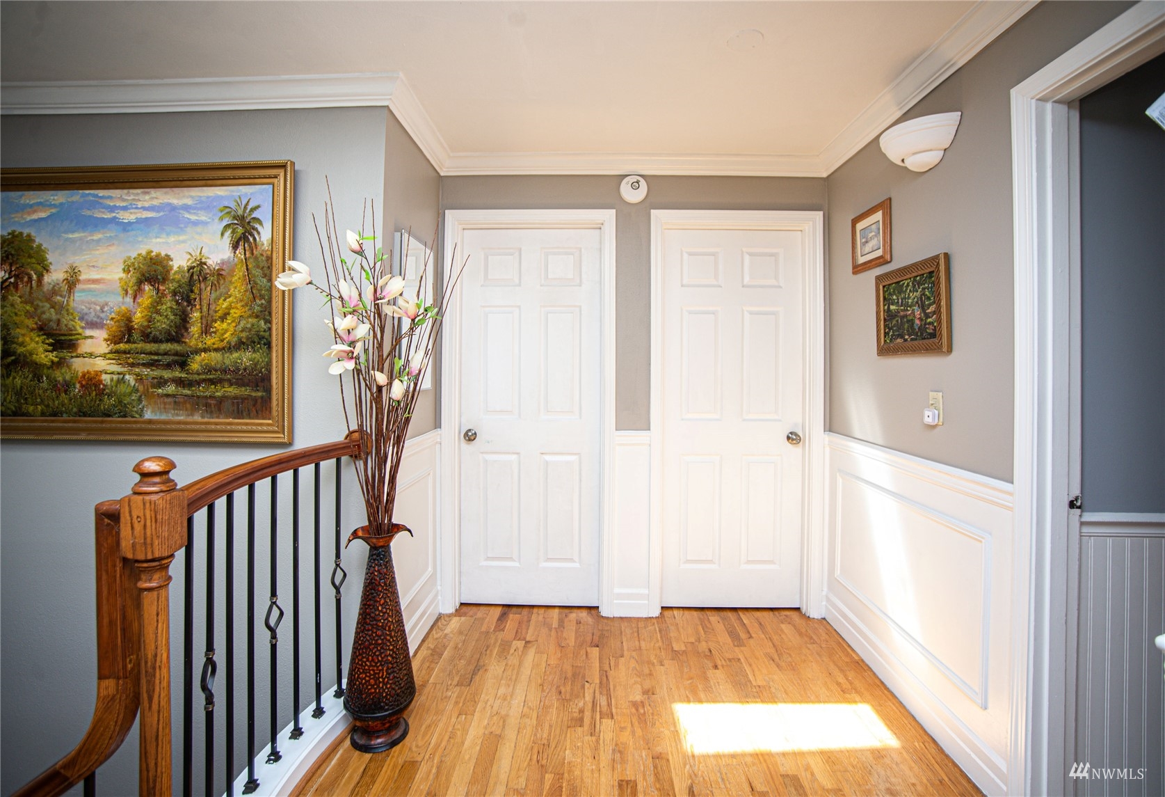 24311 3rd Place West Bothell, WA 98021 - Photo 5 of 30 a view of a hallway with wooden floor and door