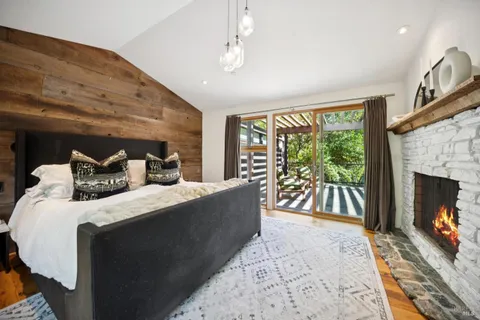 a living room with furniture fireplace and flat screen tv