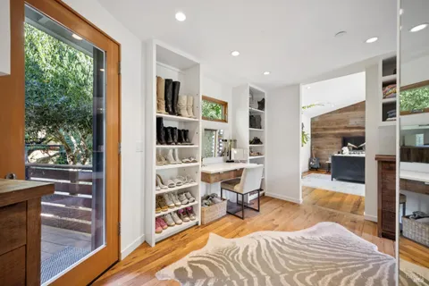 a view of a livingroom with furniture and a window