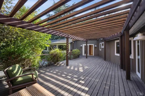 a view of a porch with wooden floor