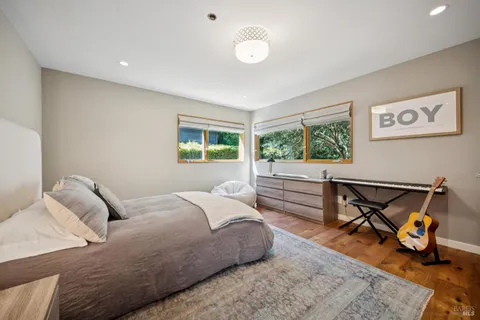 a bedroom with furniture and a window