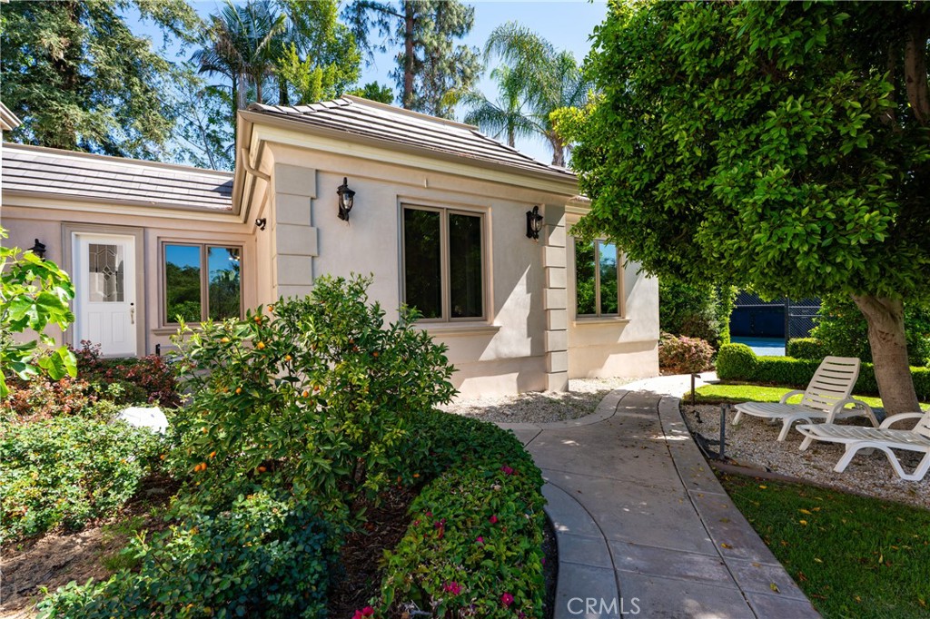 894 Fallen Leaf Road Arcadia, CA 91006 - Photo 26 of 28 a view of a patio with table and chairs potted plants and large tree