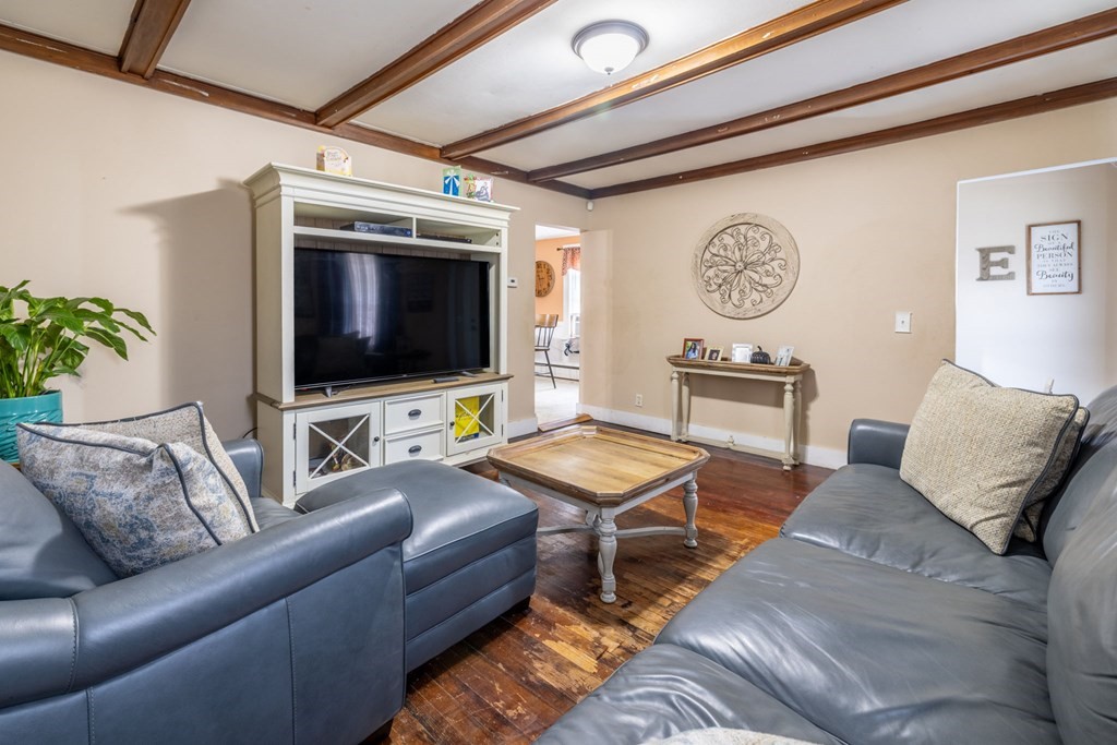 324 Stafford Road Fall River, MA 02721 - Photo 19 of 41 a living room with furniture and a flat screen tv