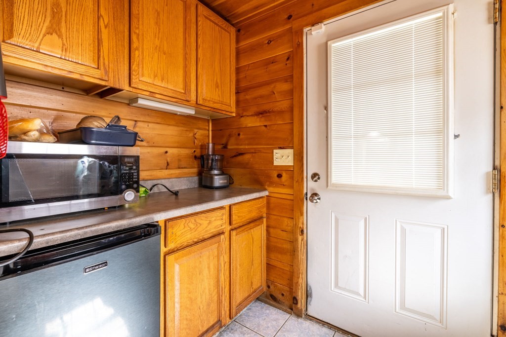 324 Stafford Road Fall River, MA 02721 - Photo 26 of 41 a kitchen with stainless steel appliances a sink and a microwave