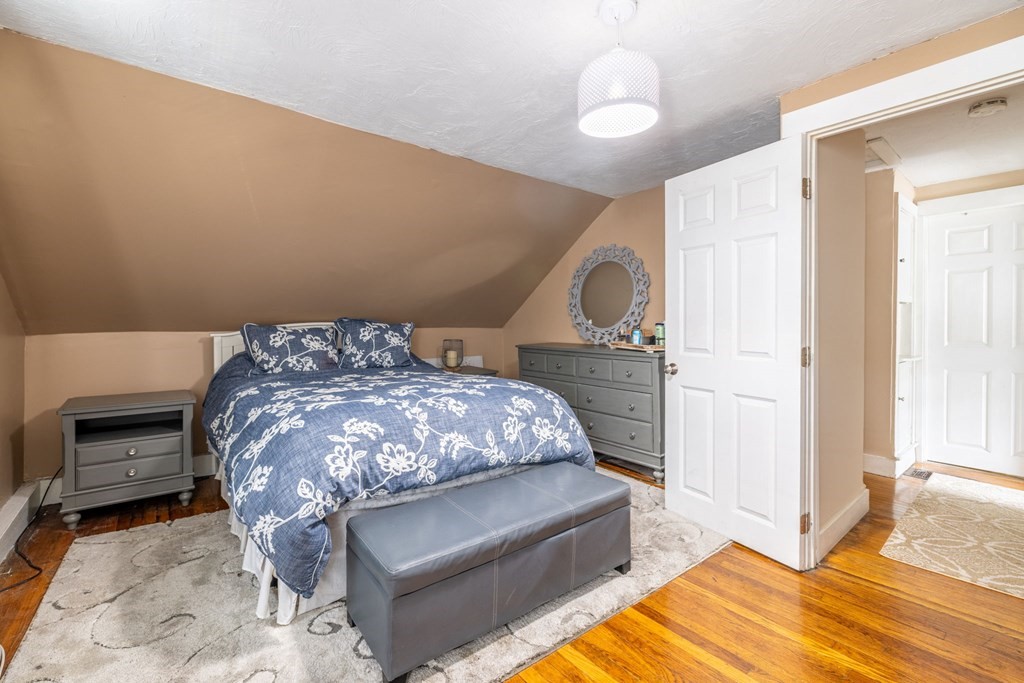 324 Stafford Road Fall River, MA 02721 - Photo 34 of 41 a bedroom with a bed and a fireplace