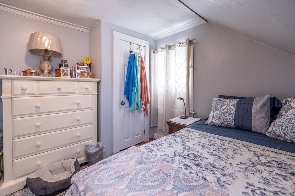 324 Stafford Road Fall River, MA 02721 - Photo 36 of 41 a bedroom with a large bed and a dresser