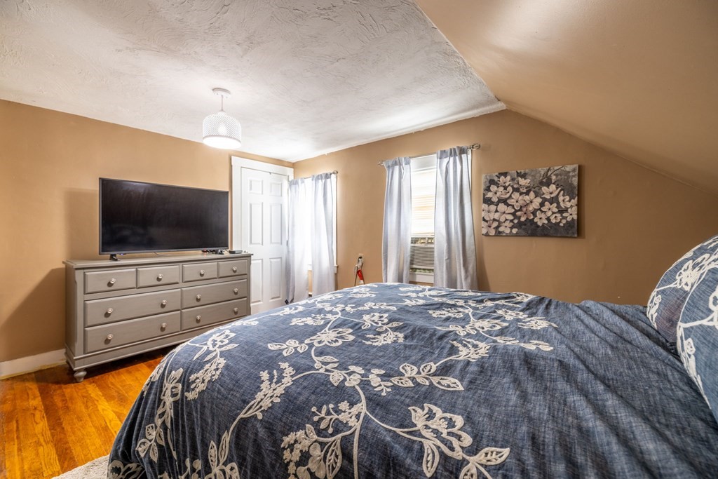 324 Stafford Road Fall River, MA 02721 - Photo 39 of 41 a bedroom with a bed and a flat screen tv