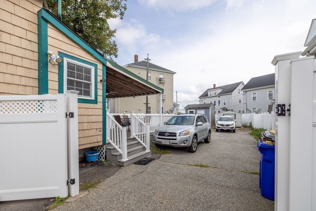 324 Stafford Road Fall River, MA 02721 - Photo 5 of 41 a view of cars parked in front of a house