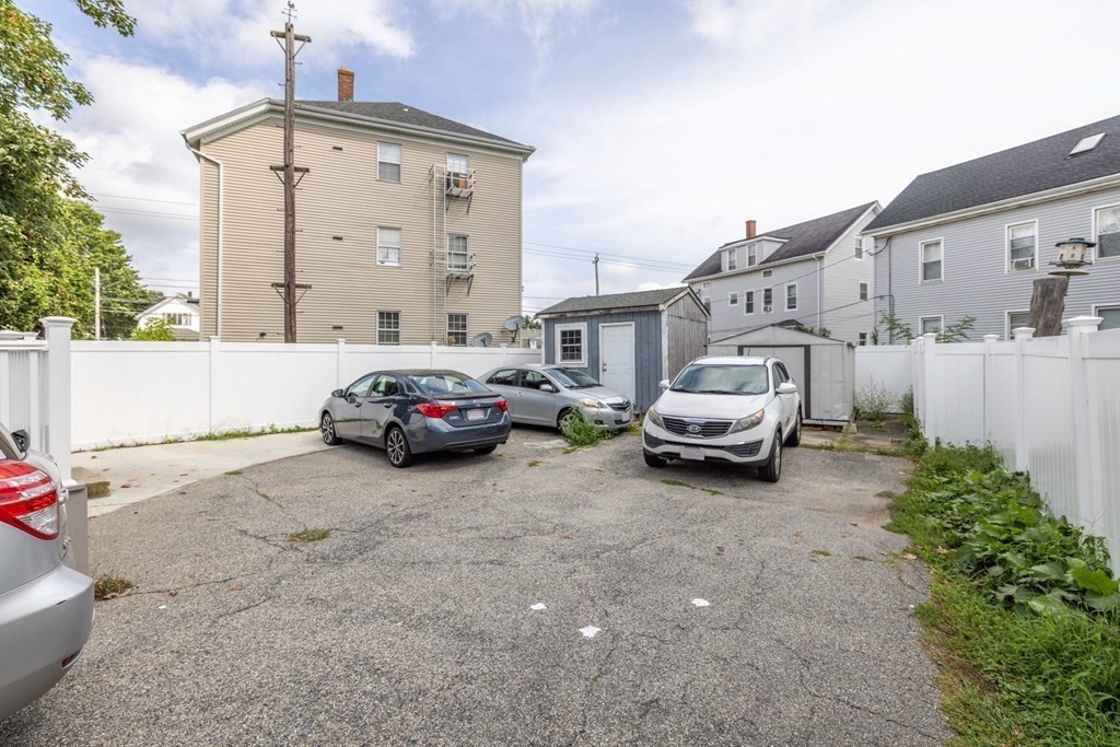 324 Stafford Road Fall River, MA 02721 - Photo 9 of 41 a car parked in front of a house