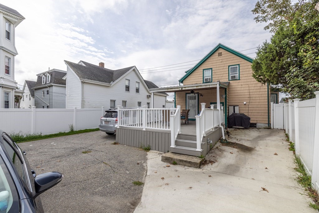 324 Stafford Road Fall River, MA 02721 - Photo 10 of 41 a view of a house with wooden fence