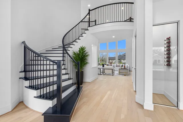 a view of entryway and hall with a bath tub