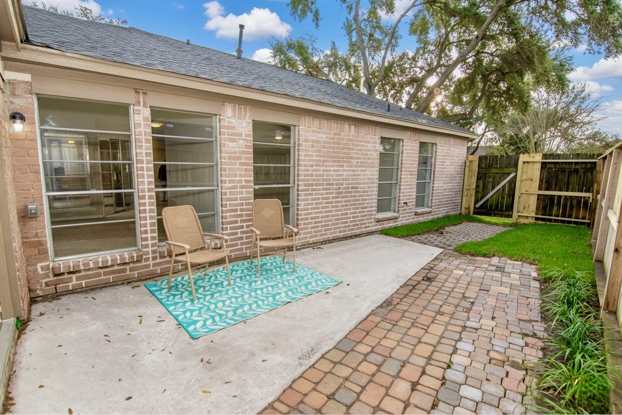 6703 Stonewater Houston, TX 77084 - Photo 25 of 30 Patio area with ample space for a sitting venue or set up as an entertaining space.