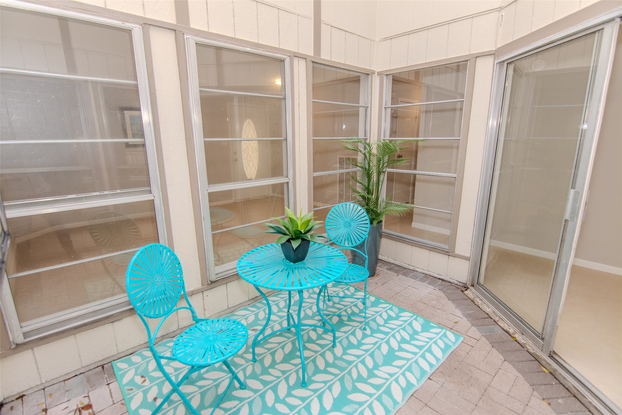 6703 Stonewater Houston, TX 77084 - Photo 25 of 33 Cozy enclosed patio with large windows, featuring - perfect for drinking your morning coffee, relaxing or entertaining.