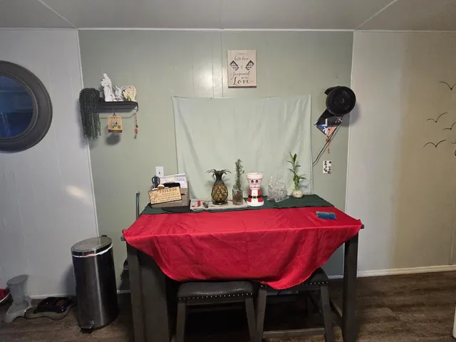 a view of a room with furniture and wooden floor