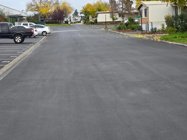 a view of street with parked cars