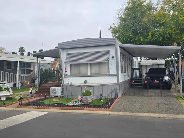 a view of a car park in front of house
