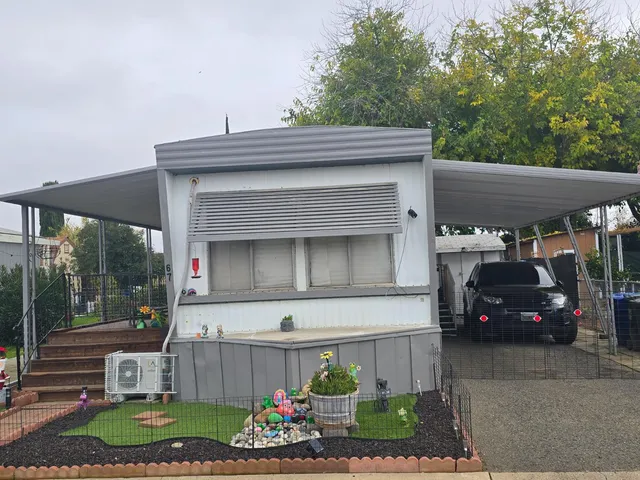 a view of house and car parked