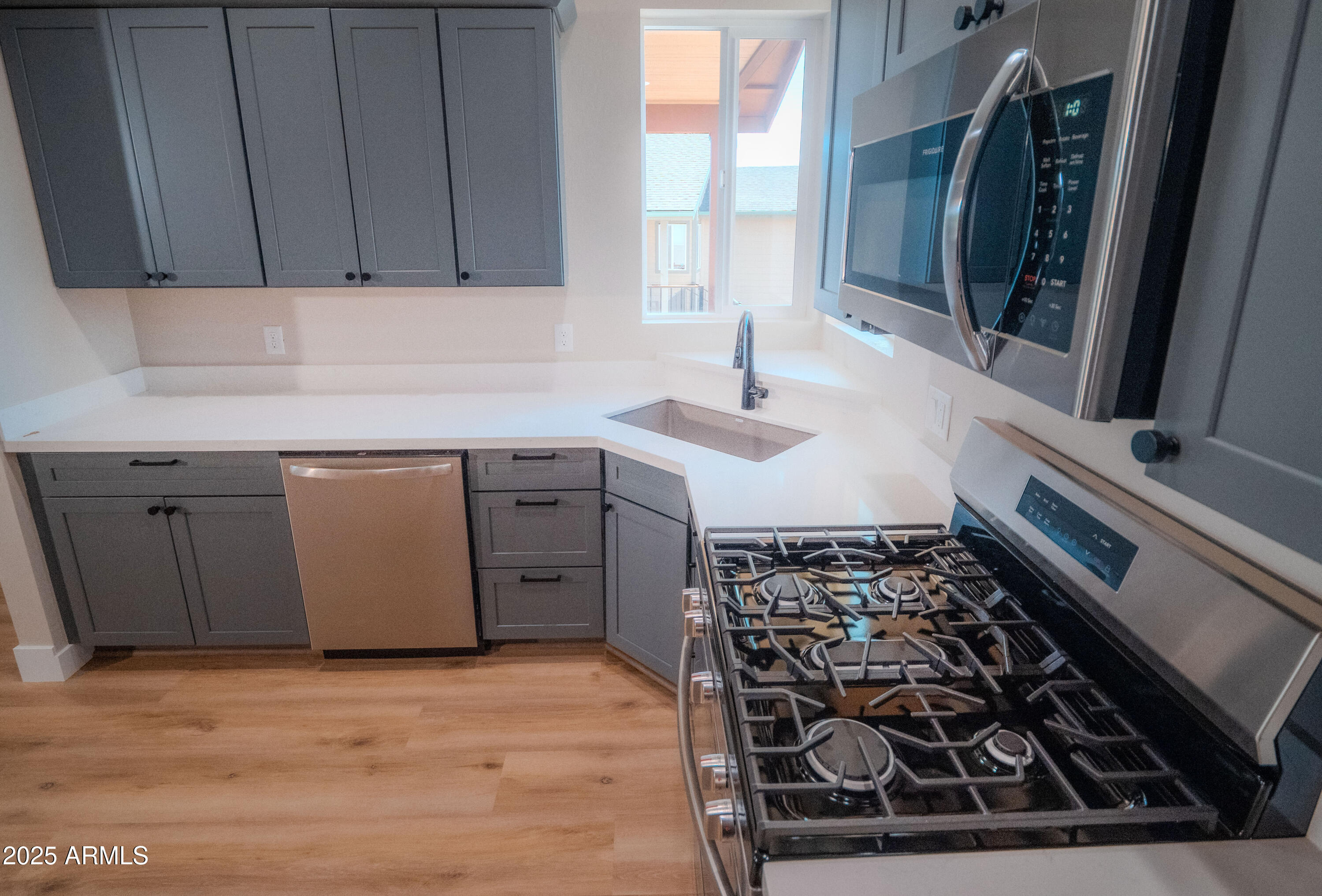 941 South Ridgeway Place Show Low, AZ 85901 - Photo 13 of 67 a kitchen with a sink stove and cabinets