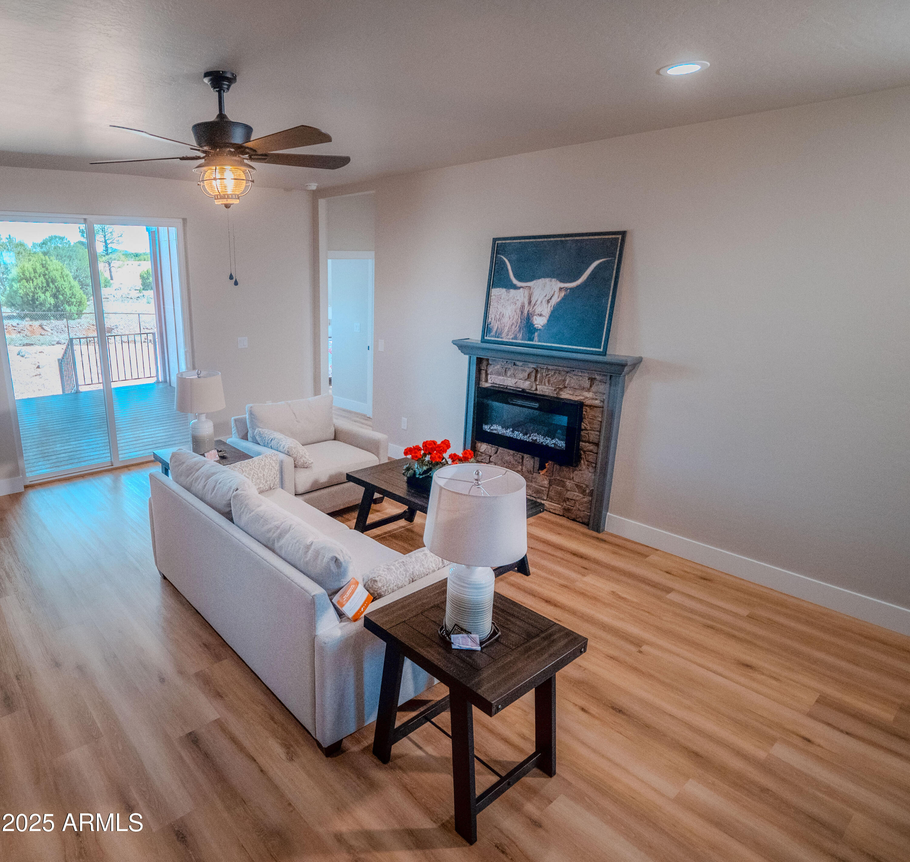 941 South Ridgeway Place Show Low, AZ 85901 - Photo 2 of 67 a living room with furniture a fireplace and a table
