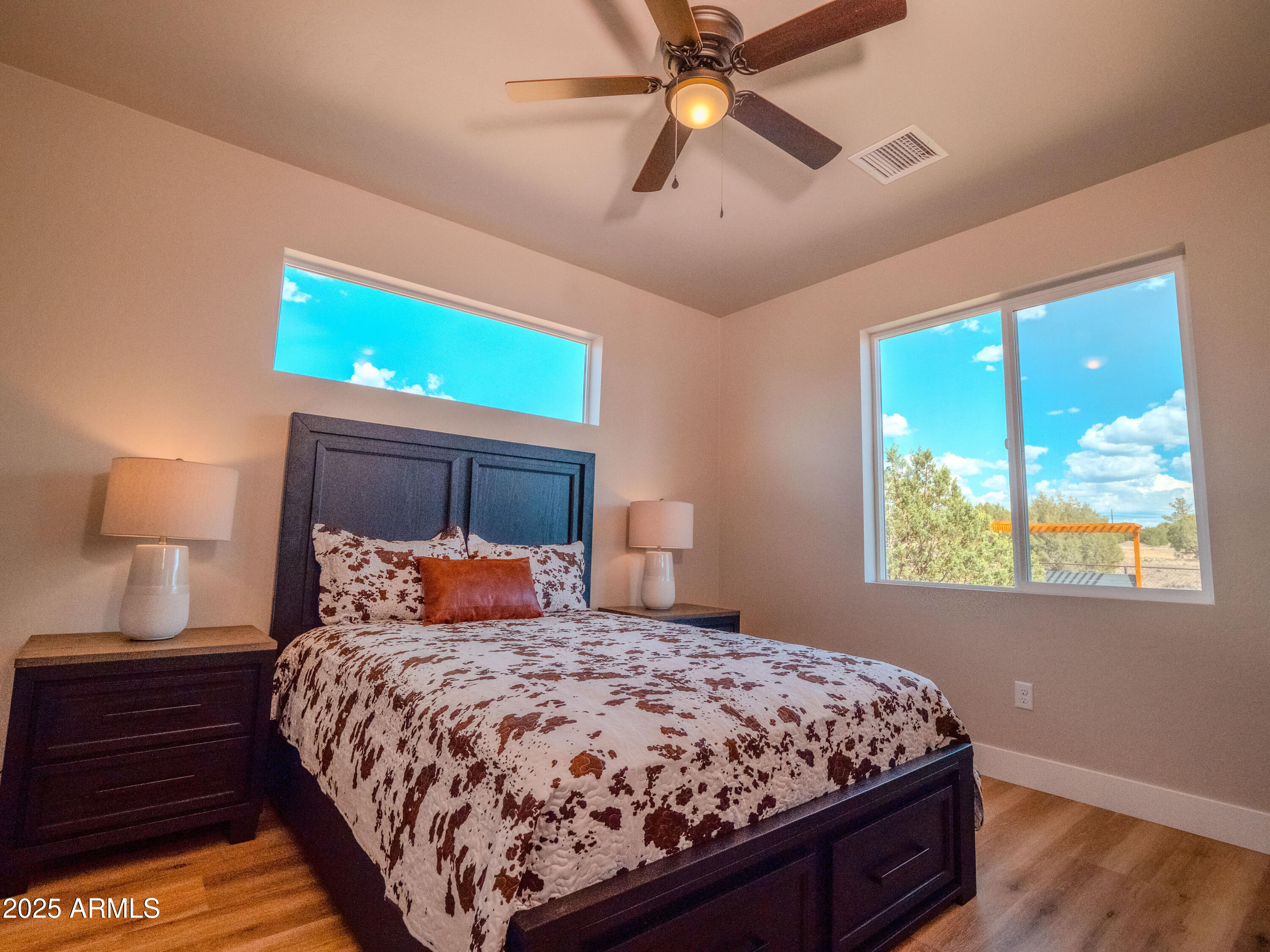 941 South Ridgeway Place Show Low, AZ 85901 - Photo 25 of 67 a bedroom with a bed and a window