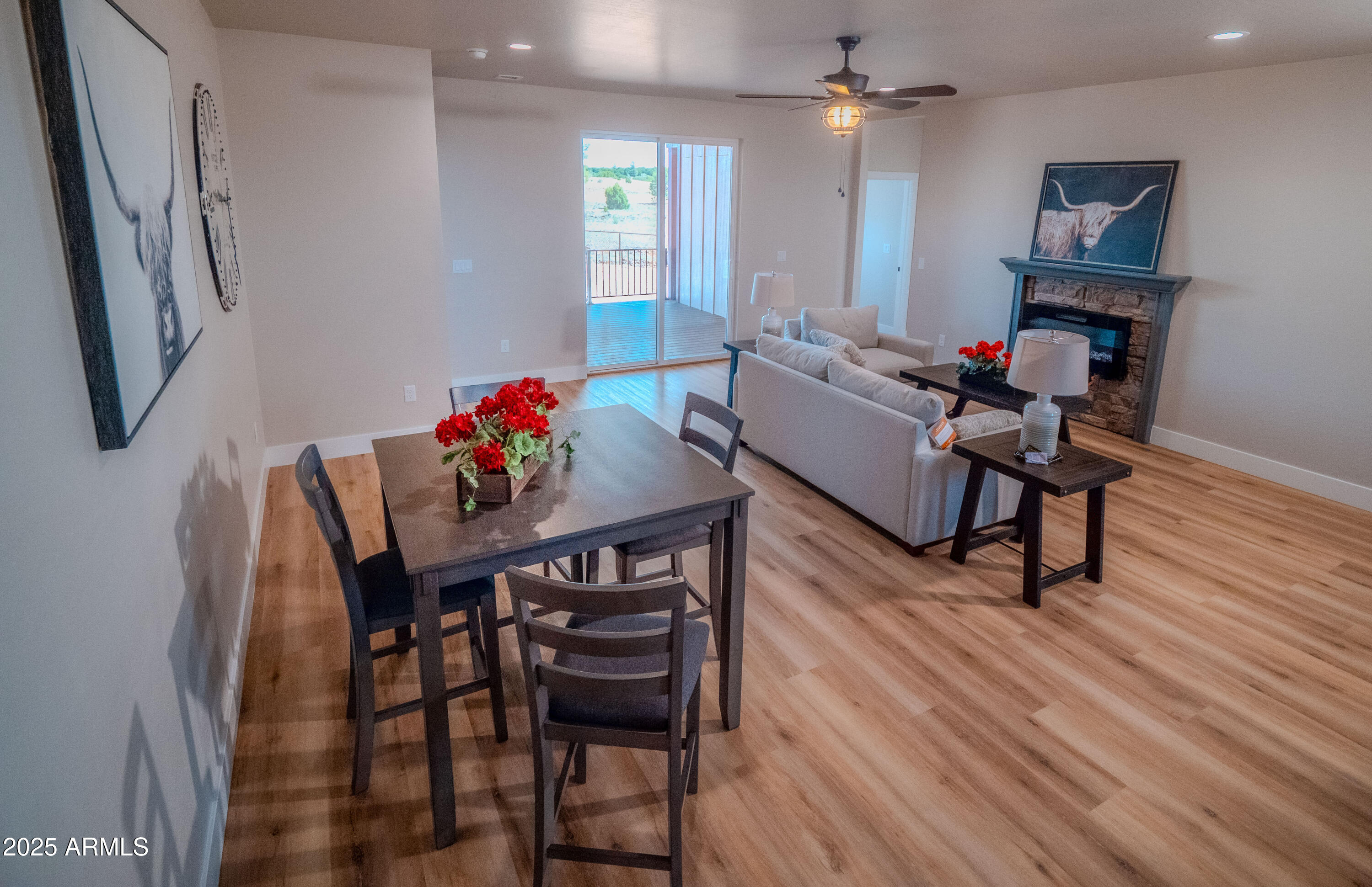 941 South Ridgeway Place Show Low, AZ 85901 - Photo 3 of 67 a view of a dining room with furniture and wooden floor