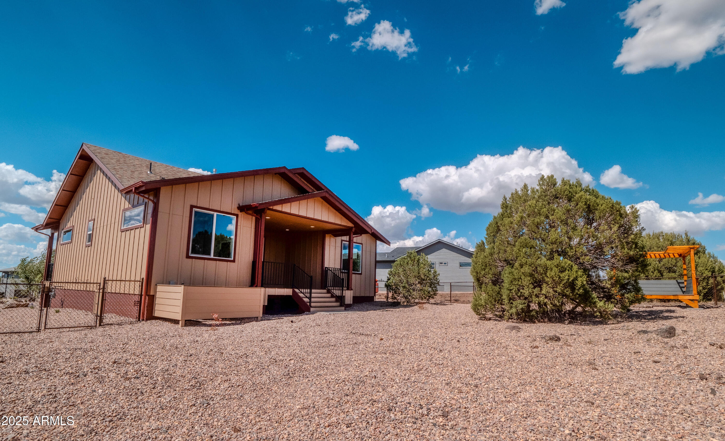 941 South Ridgeway Place Show Low, AZ 85901 - Photo 42 of 67 a front view of a house with a yard and garage