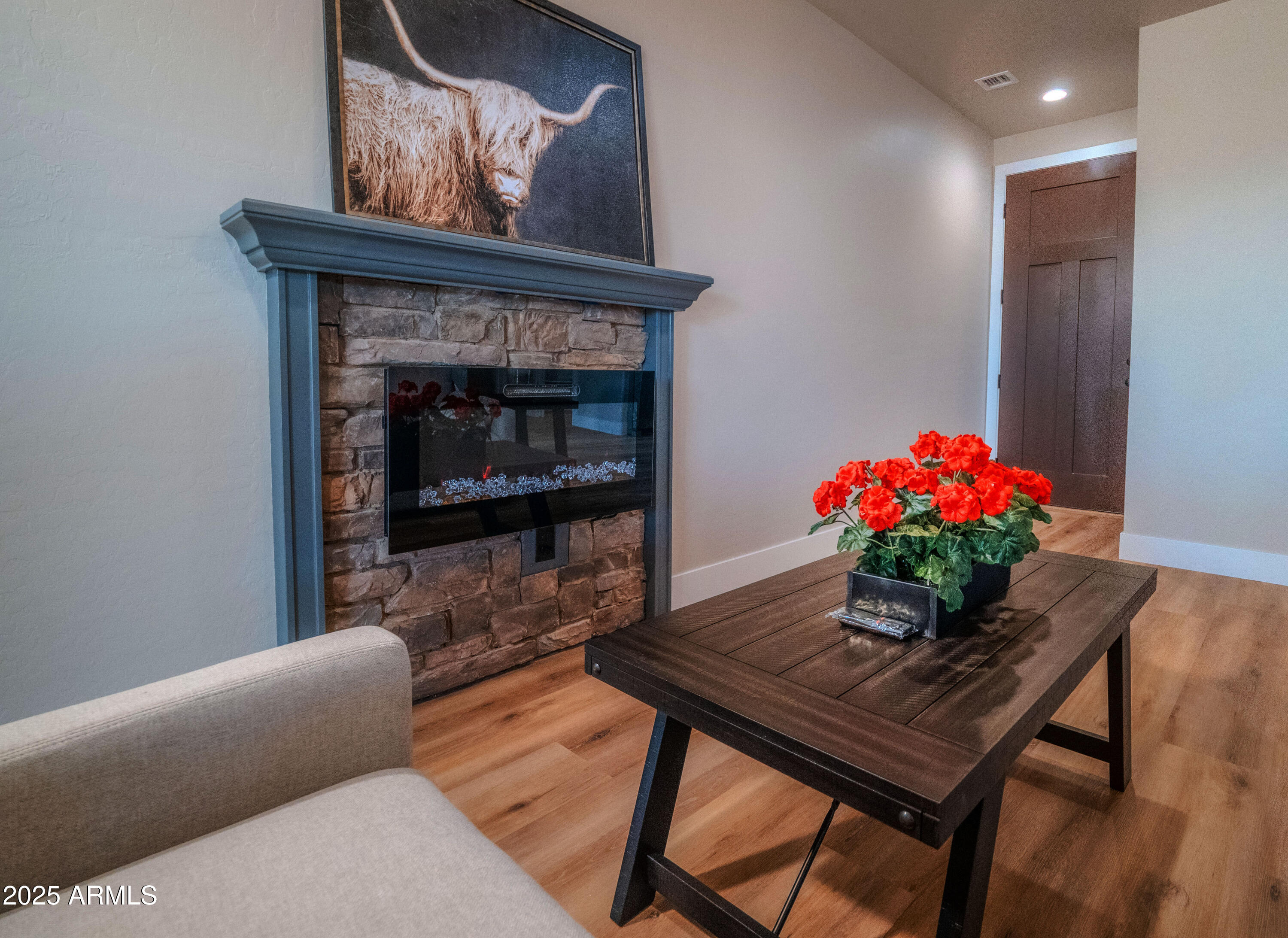 941 South Ridgeway Place Show Low, AZ 85901 - Photo 5 of 67 a living room with furniture and a fireplace