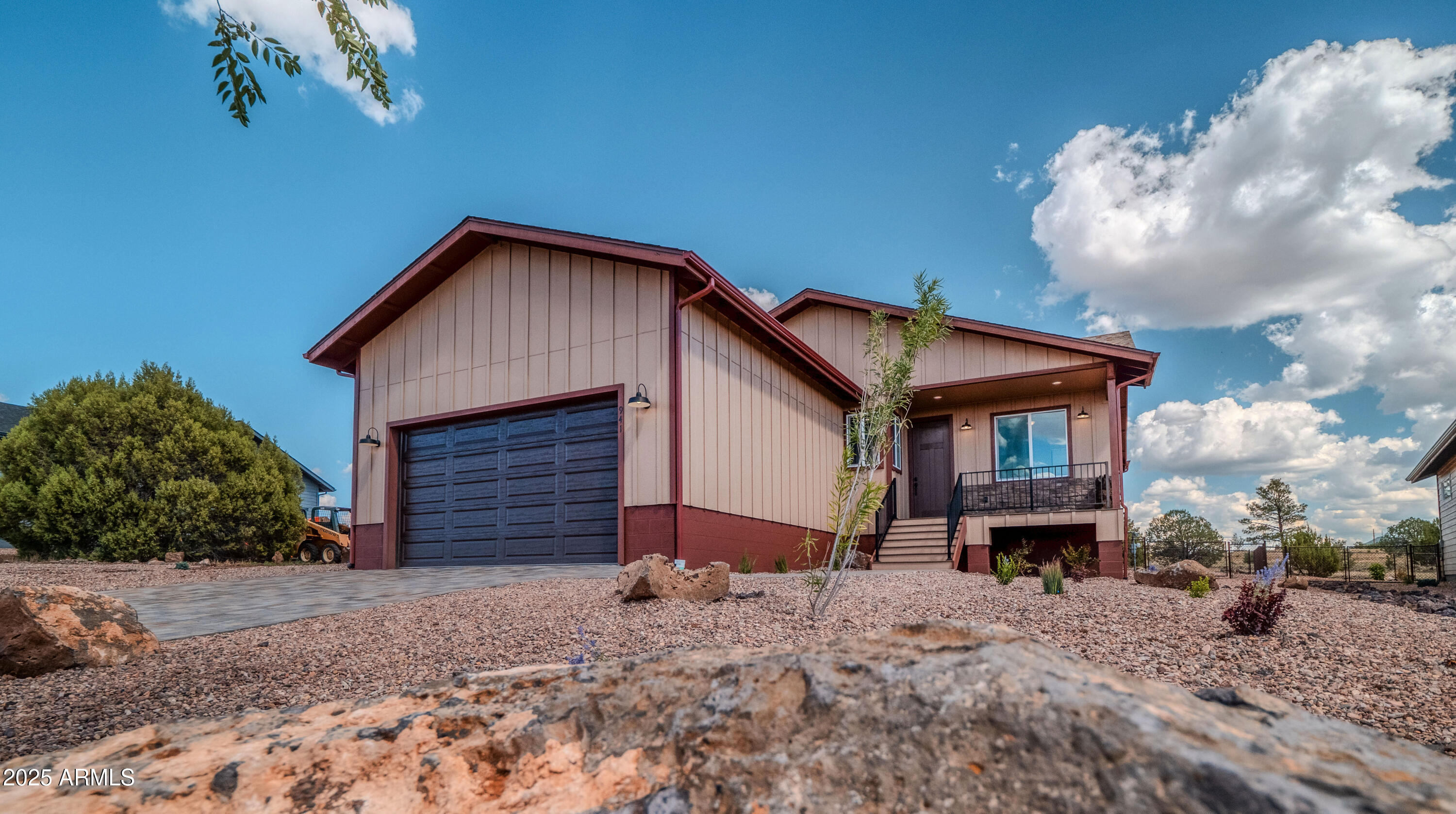 941 South Ridgeway Place Show Low, AZ 85901 - Photo 51 of 67 a front view of a house with a yard and garage