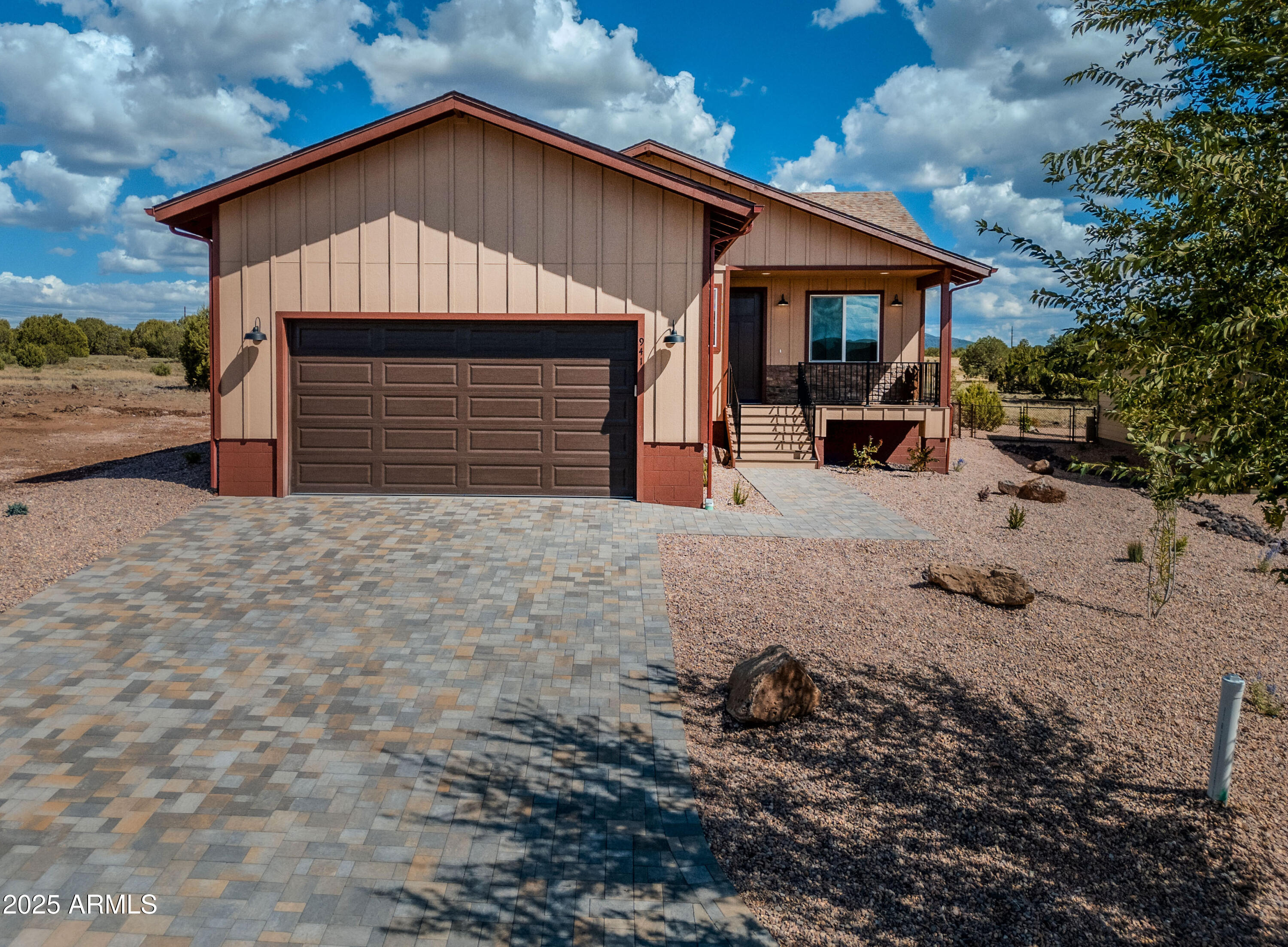 941 South Ridgeway Place Show Low, AZ 85901 - Photo 56 of 67 a front view of a house with a yard and garage