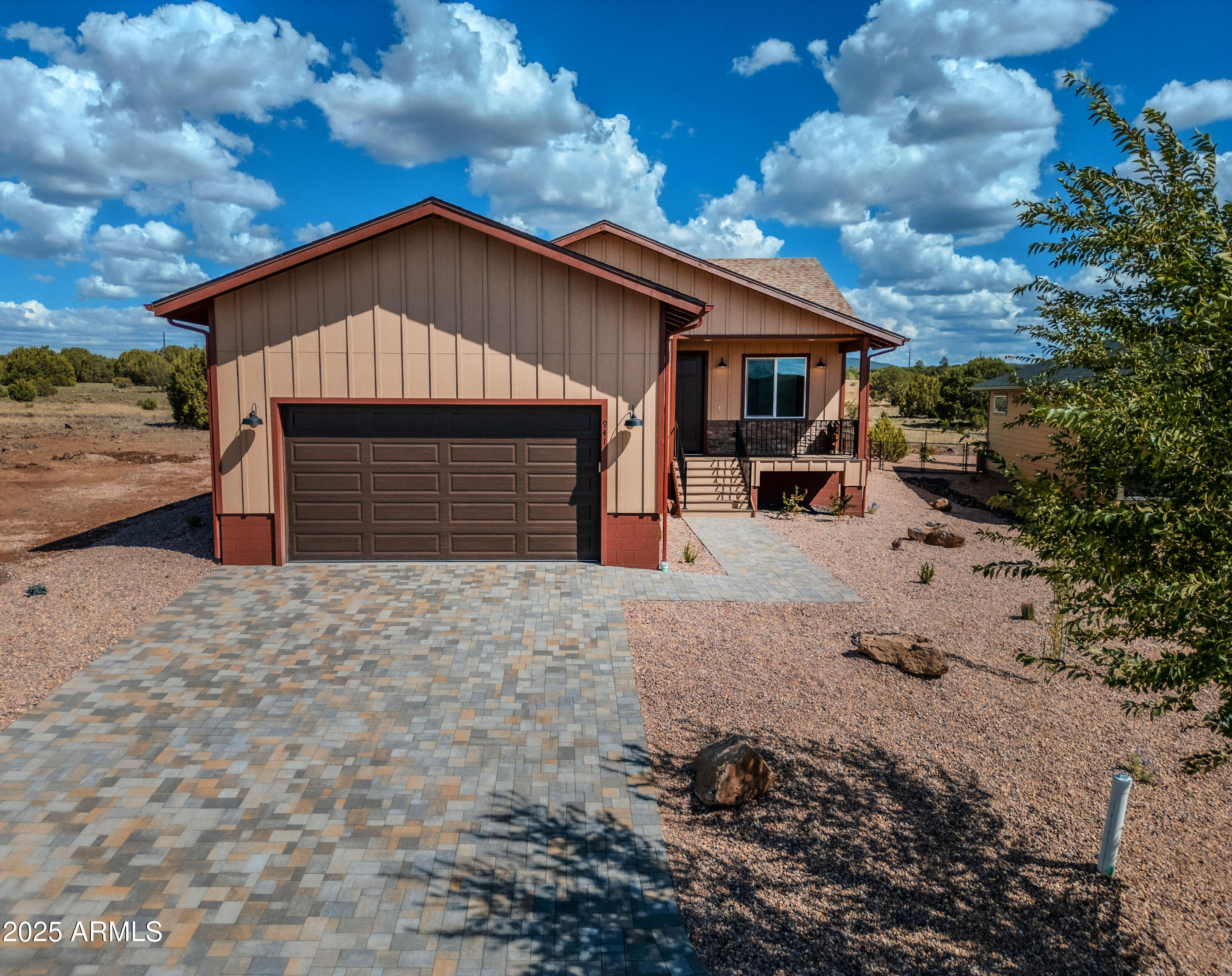 941 South Ridgeway Place Show Low, AZ 85901 - Photo 57 of 67 a front view of a house with a yard and garage