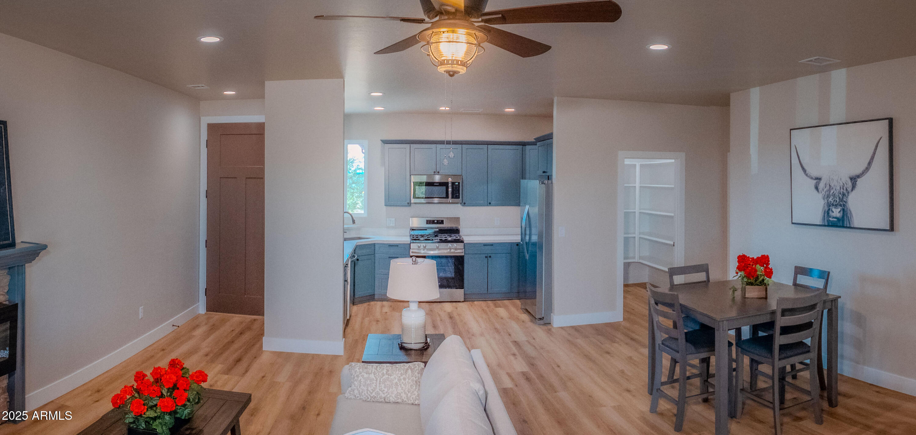 941 South Ridgeway Place Show Low, AZ 85901 - Photo 8 of 67 a view of a dining room with furniture and wooden floor