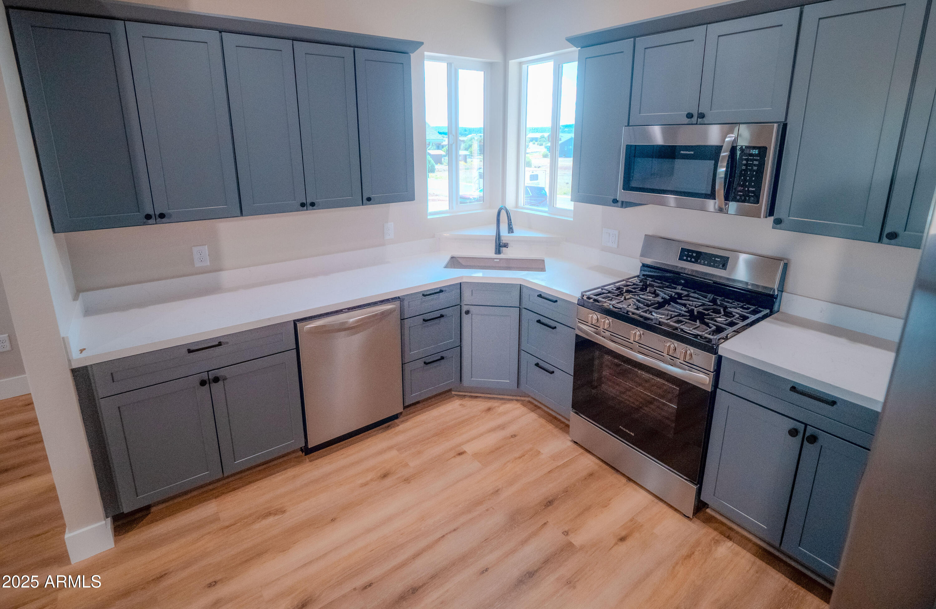 941 South Ridgeway Place Show Low, AZ 85901 - Photo 9 of 67 a kitchen with sink cabinets and window