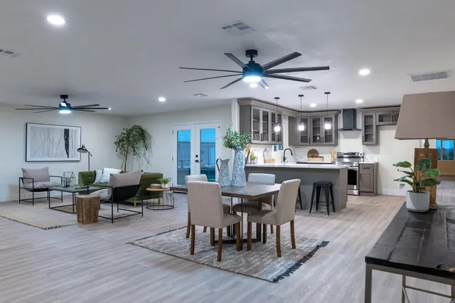 a view of a dining room with furniture window and wooden floor