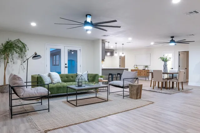 a living room with furniture and a large window