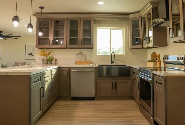 a kitchen with a sink stove and cabinets