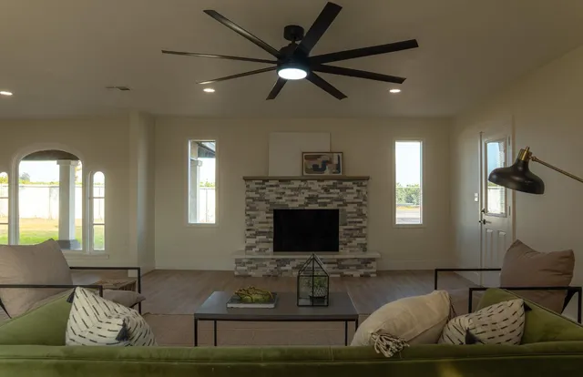 a living room with furniture and a fireplace