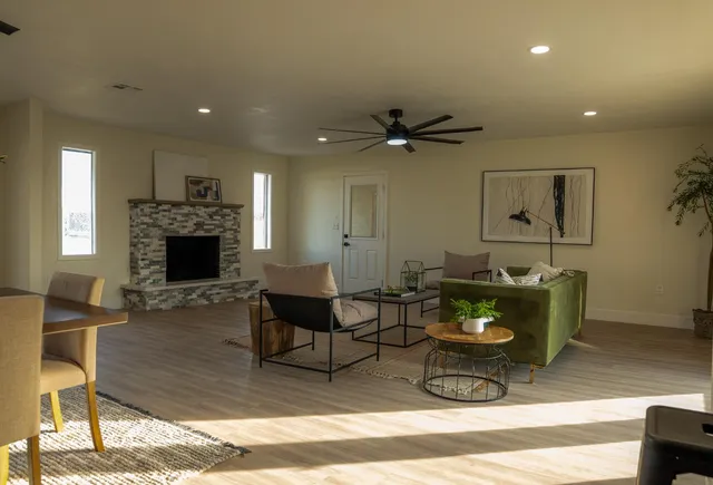 a living room with furniture and a fireplace