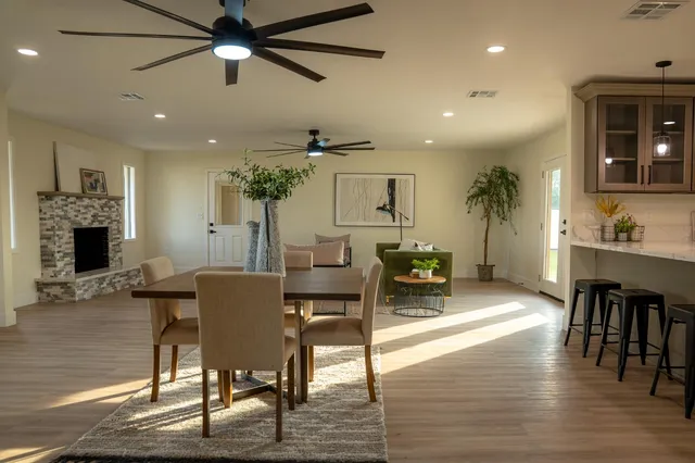 a view of a dining room with furniture and wooden floor