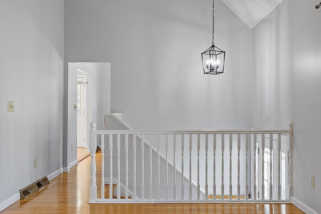 45 Bellflower Road Billerica, MA 01821 - Photo 3 of 42 a view of staircase with railing and white walls