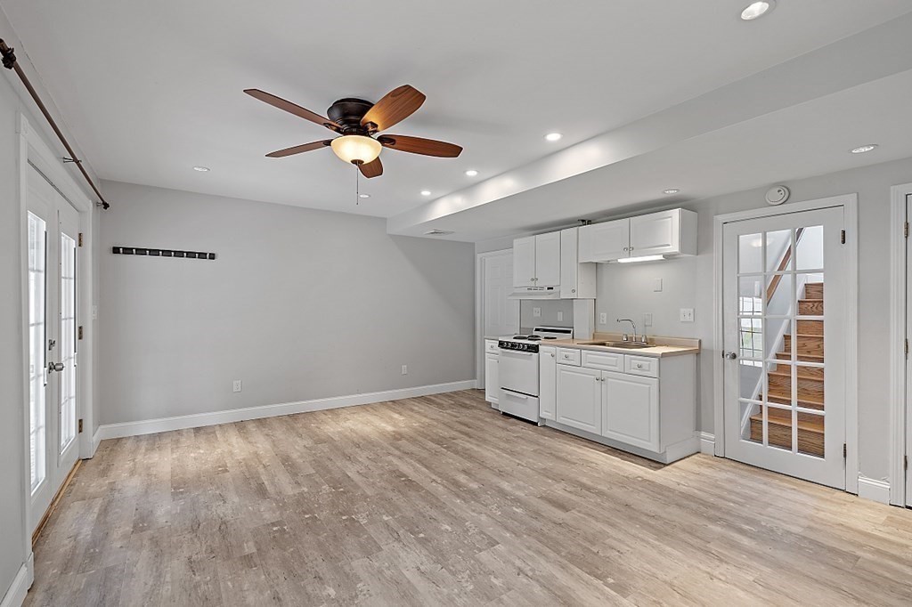 45 Bellflower Road Billerica, MA 01821 - Photo 34 of 42 a view of a kitchen with a sink hardwood floor and a window